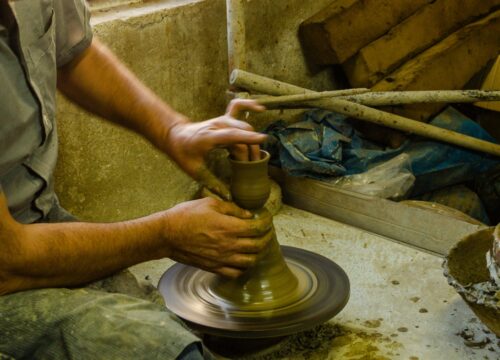 Shaping clay in a traditional workshop