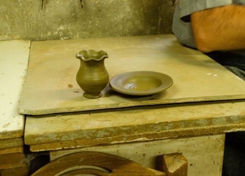Shaping clay in a traditional workshop